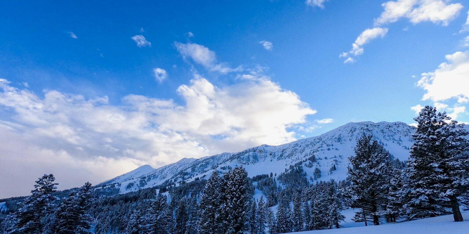 snow covered mountain under blue sky during daytime