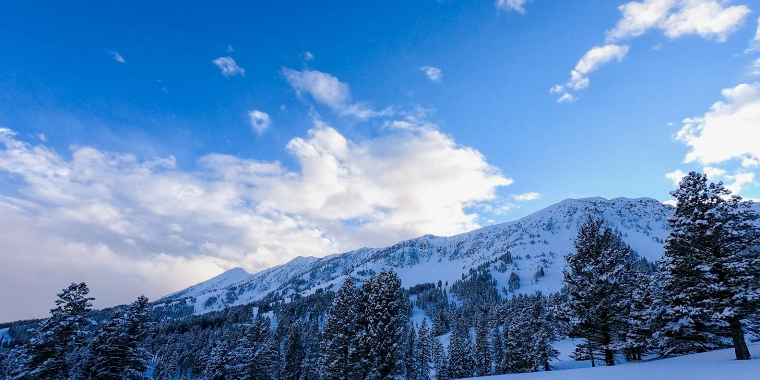 snow covered mountain under blue sky during daytime